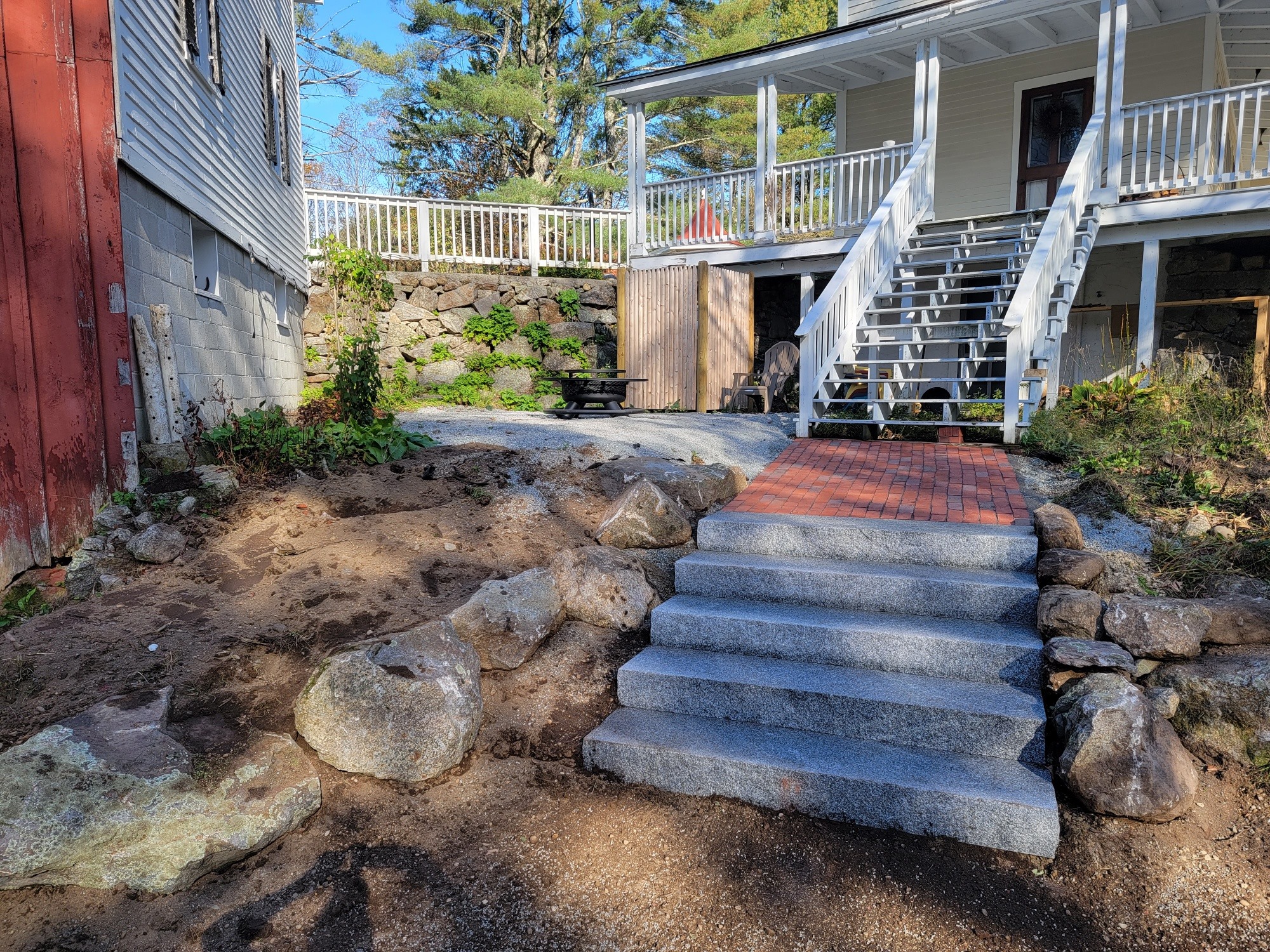 Completed patio and stone walkway after hardscaping