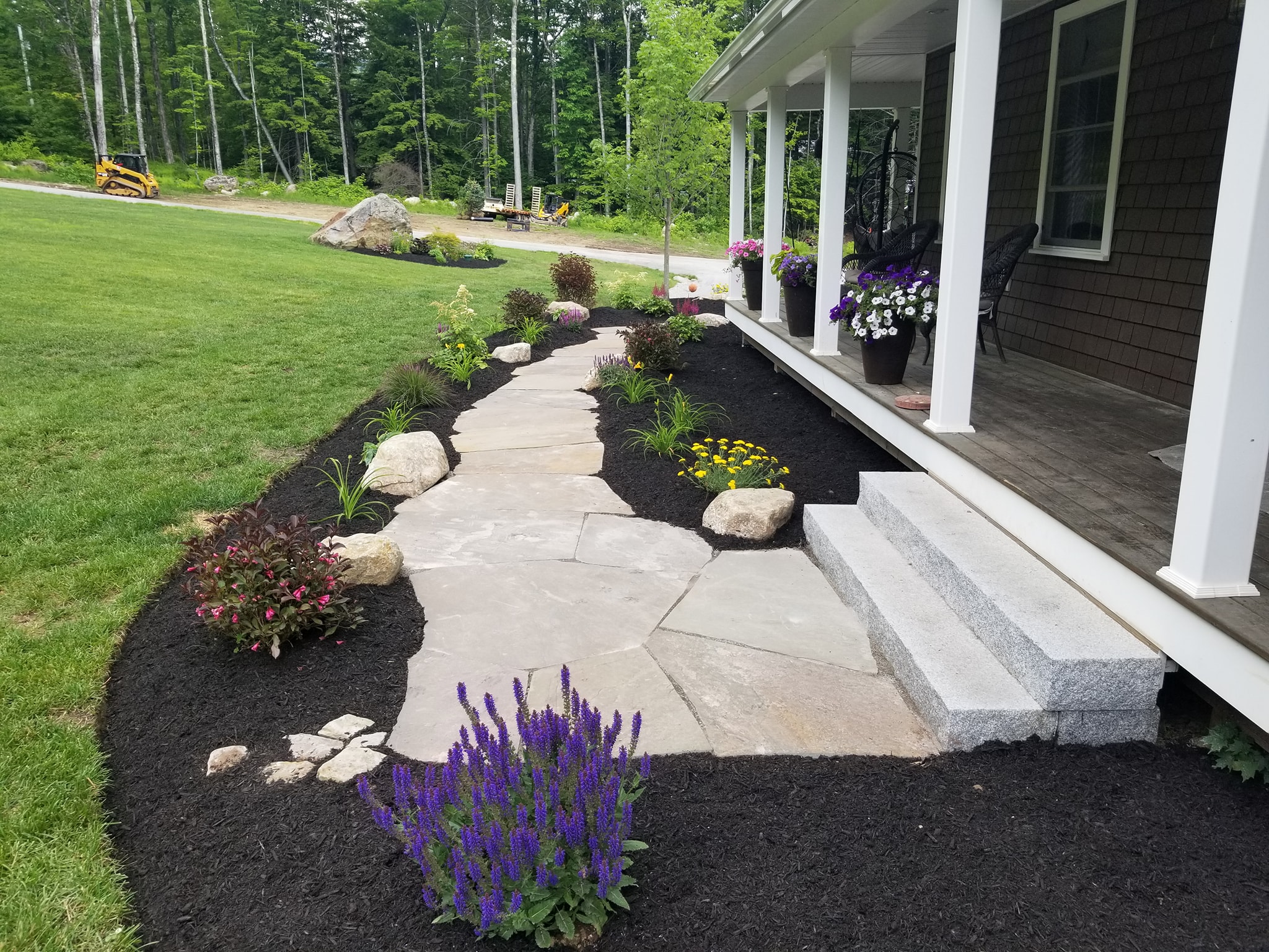 Finished retaining wall and landscape after transformation