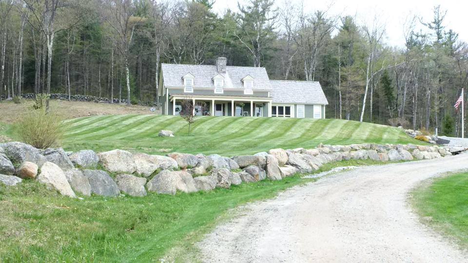 Maintained residential landscape with healthy lawn and trimmed beds