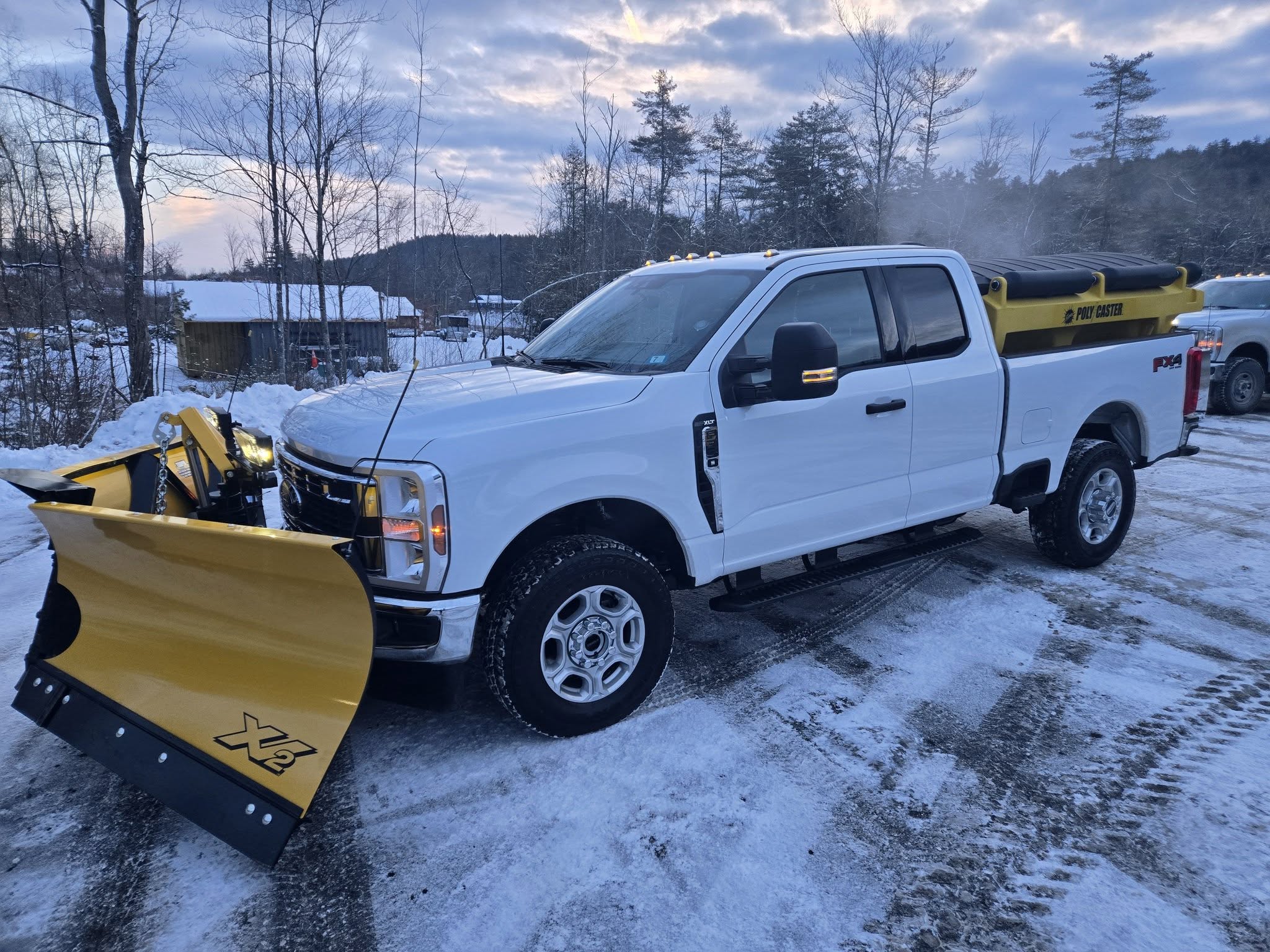 Snow plow clearing a road after a storm