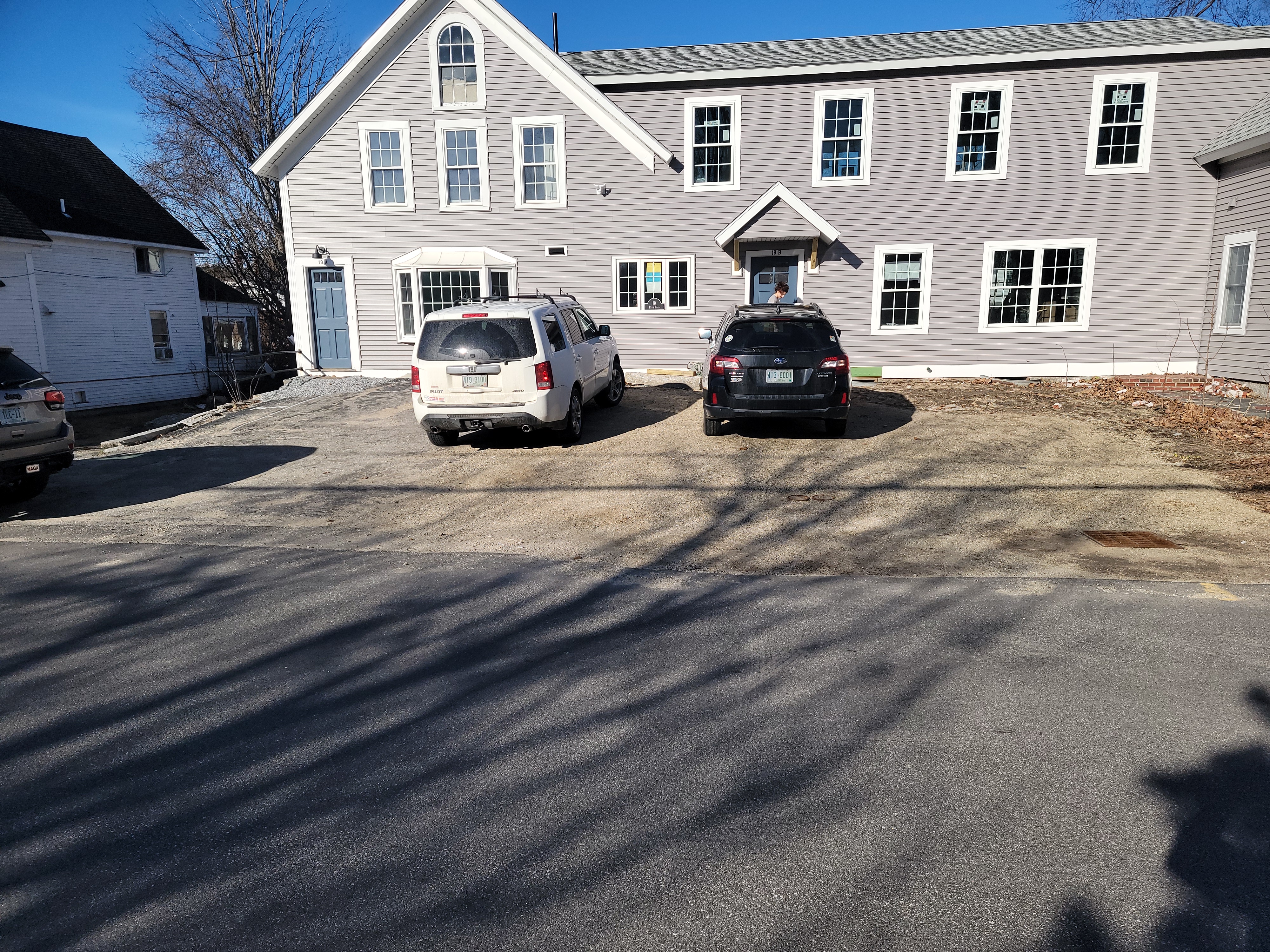 Mixed-use building with dirt drive before pavement work