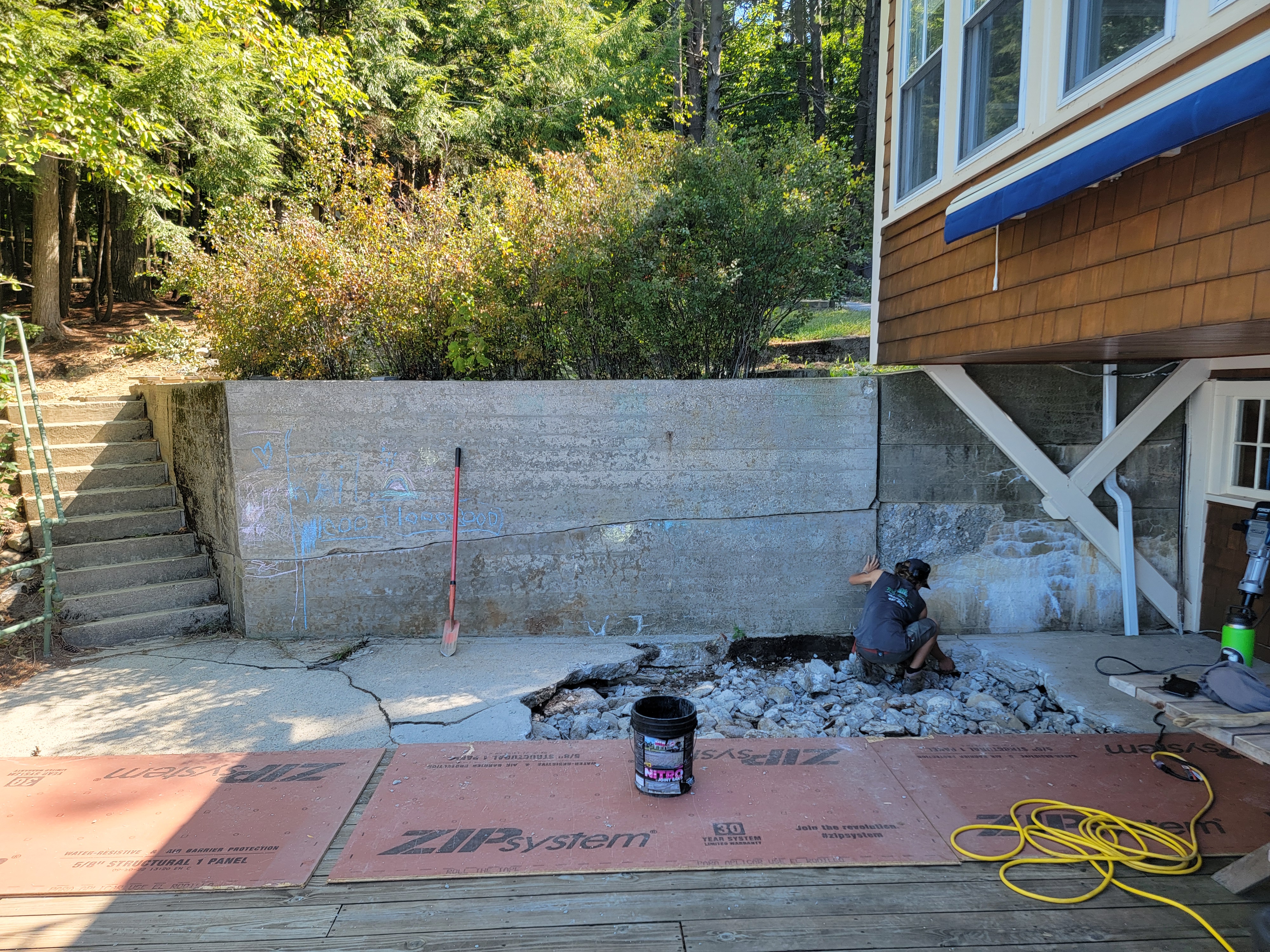 Cracked old concrete patio being demolished